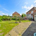 Sunny garden with patio and pergola