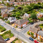 Aerial view of suburban houses and streets.