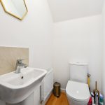 Small bathroom with toilet and sink.