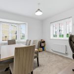 Bright dining room with table and chairs.