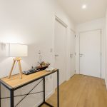 Modern hallway with lamp and decorative items