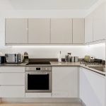 Modern kitchen with built-in appliances and workspace.