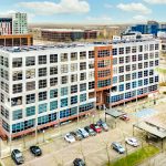 Modern office building with car park.