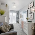 Modern living room with grey sofa and decor.