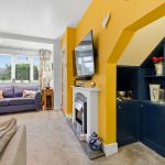 Cosy living room with modern decor and fireplace.