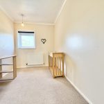 Light beige room with desk and window